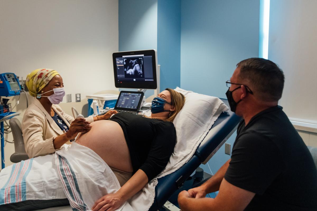 mom getting a fetal echo ultrasound with dad 