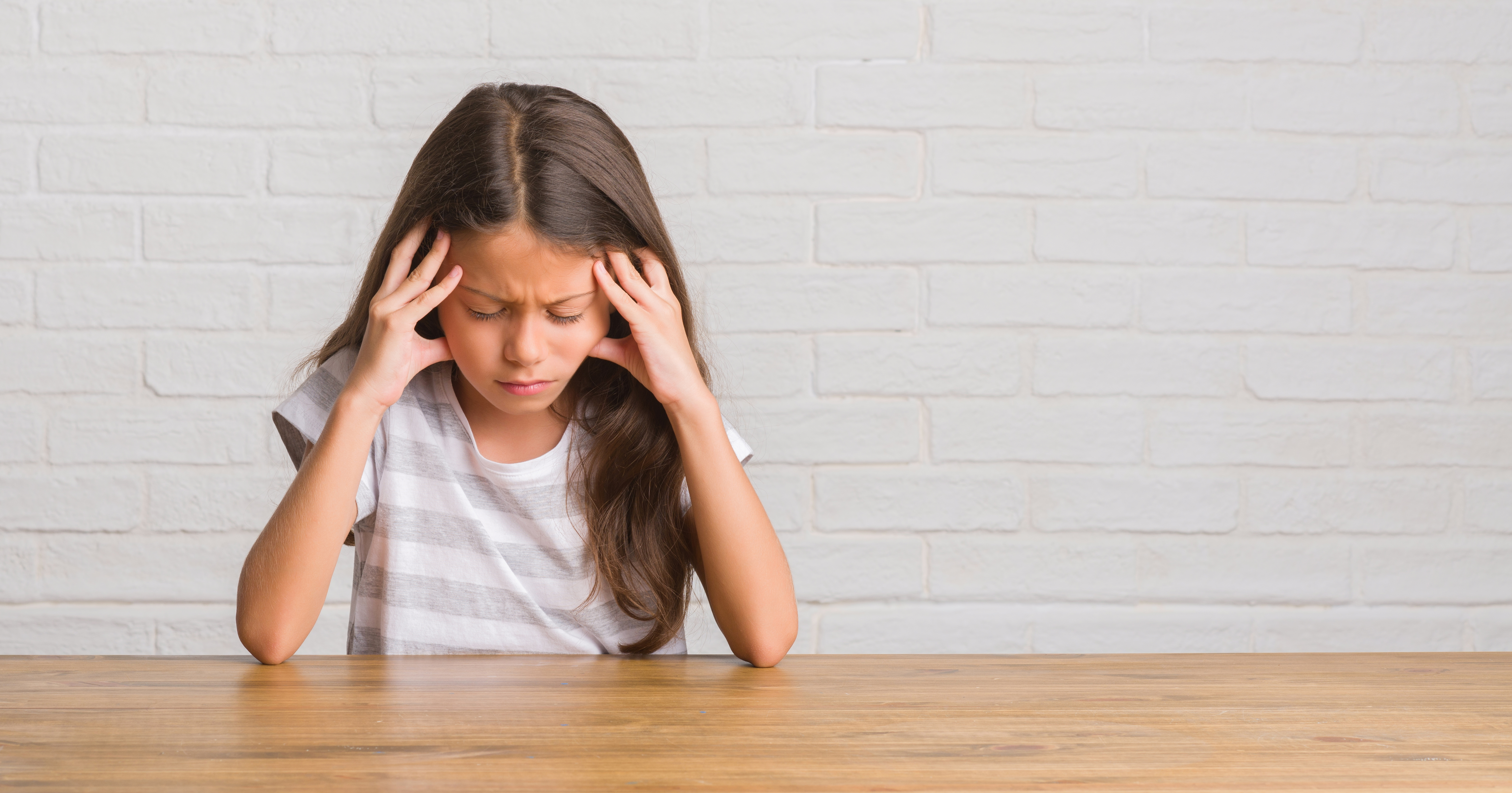 young girl with headache