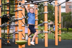 Stevie playing on the playground