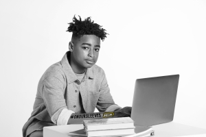 teen boy using a laptop