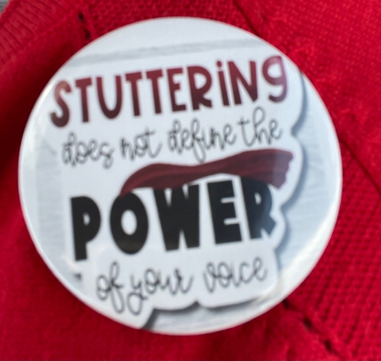 a button that says stuttering does not define the power of your voice
