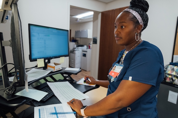 african american female nurse using a computer