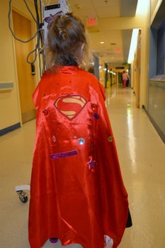 girl in cape a superhero day